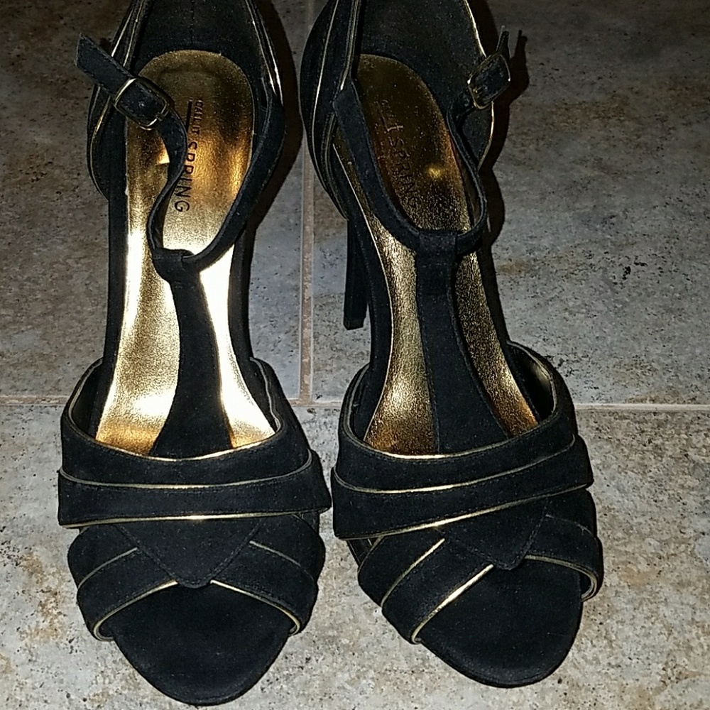 Black and gold heels worn once.